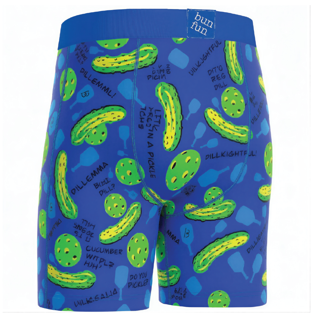 Blue swim shorts with green pickle pattern on a white background