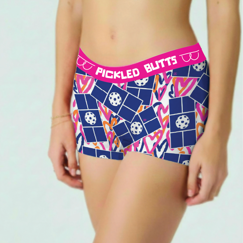 Colorful patterned pickleball underwear with 'Pickled Butts' text on a plain background