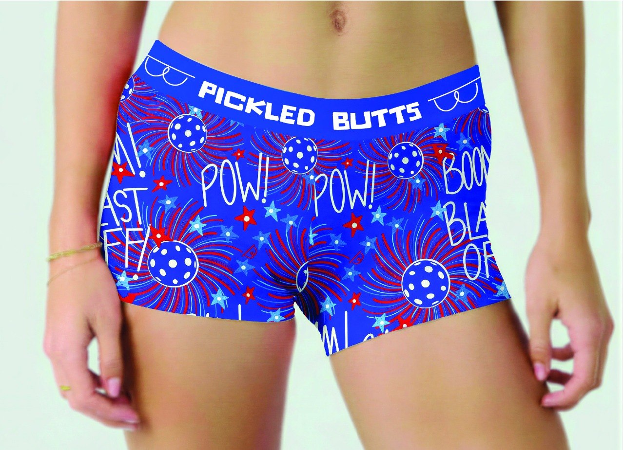 Blue boxer briefs with red and white text and designs on a person wearing them.