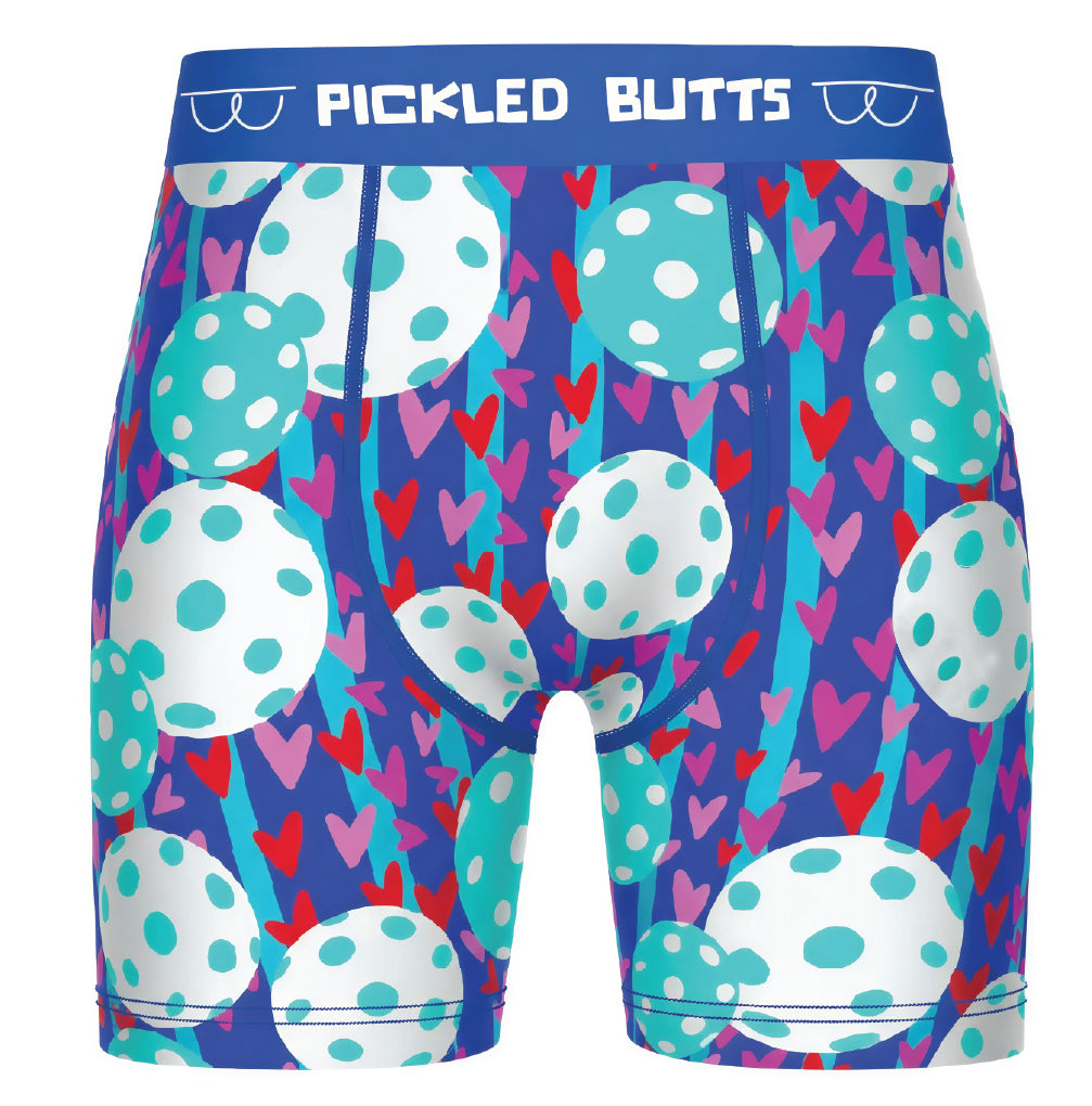 Men's boxer briefs featuring a colorful pattern of white polka-dotted eggs, pink and red hearts, and blue stripes on a dark purple background, with a blue waistband that reads 'PICKLED BUTTS'.