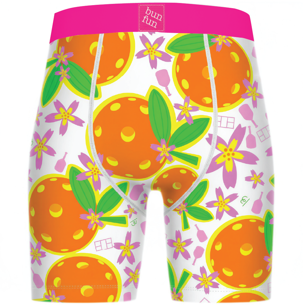 Boxer briefs with orange and floral pattern on a white background