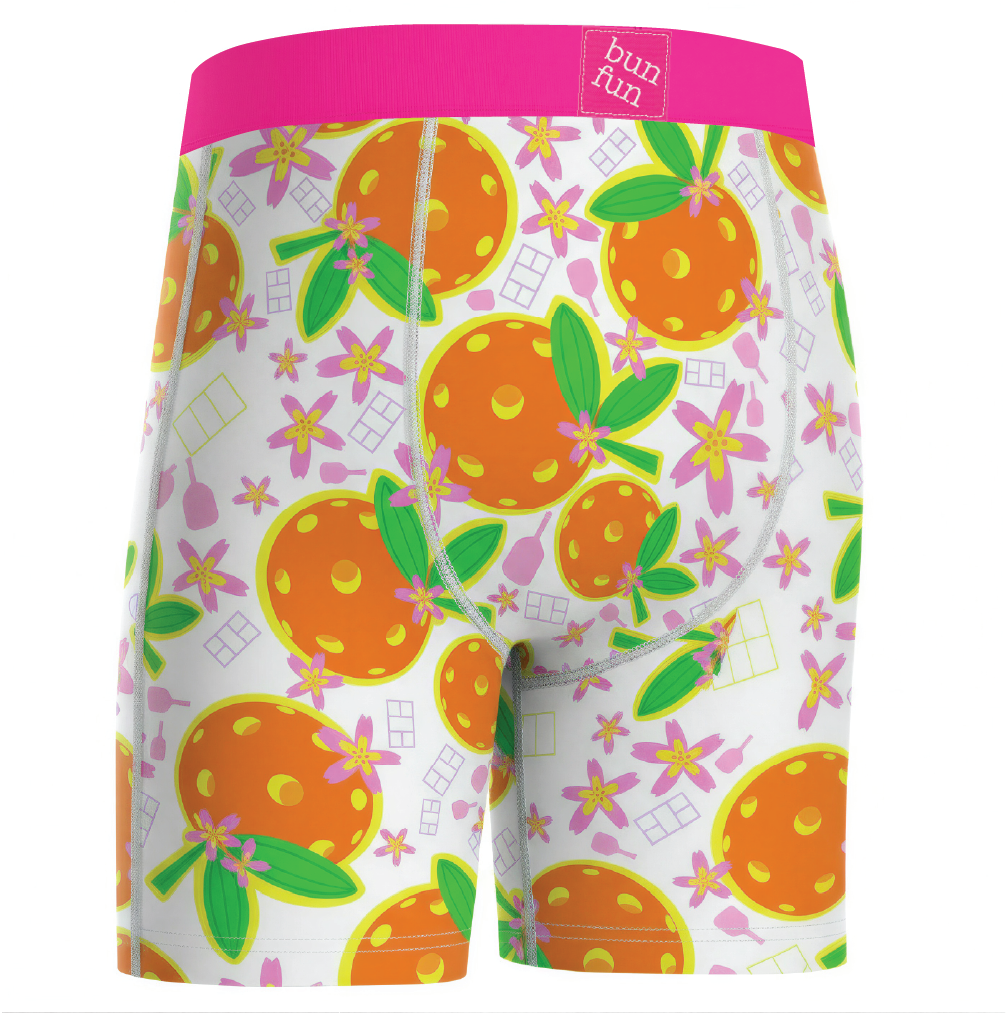Colorful boxer briefs with orange and floral pattern on a white background