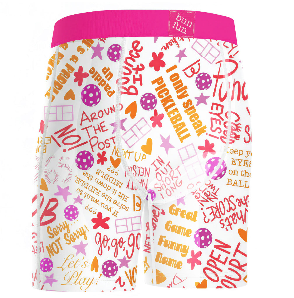White boxer briefs with a bright pink waistband and an all-over colorful retro-style text and graphic print in pink, orange, purple, and yellow, featuring a small 'bun fun' brand label on the waistband.